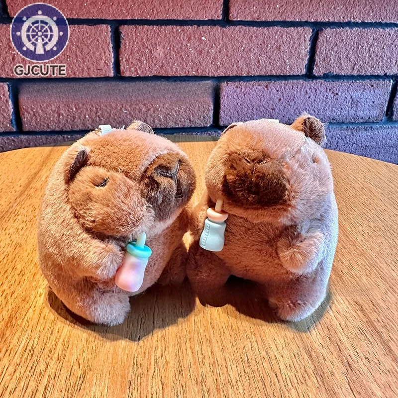 น่ารักขวด capybara จี้ของเล่นตุ๊กตาตุ๊กตาพวงกุญแจน้ำหมูกรอกพวงกุญแจกระเป๋าเสน่ห์ถุงของขวัญตกแต่งสุ่ม