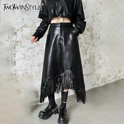 TWOTWINSTYLE Solid Designer Spliced Tassel Leather Skirt For Women High Waist Loose Temperament Skirts Female Fashion Style New