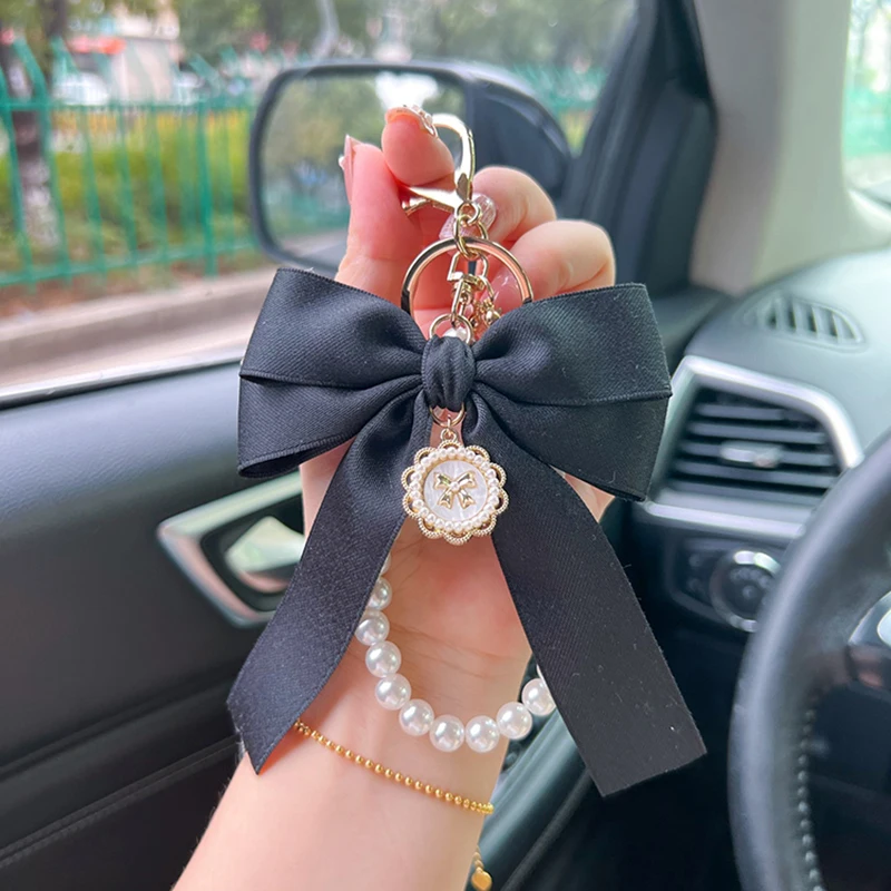 Porte-clés avec nœud créatif et perle, pendentif de sac à la mode pour femmes, porte-clés de voiture, cravate de présidence à ruban personnalisé