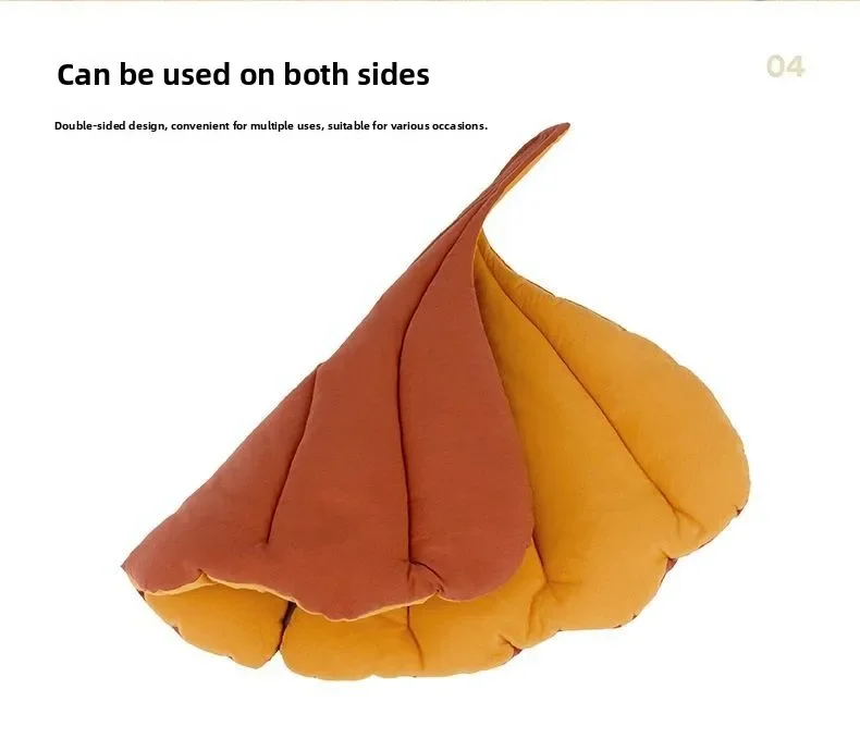 KittyNook Cat Co. Leaf Pattern Cat Sleeping Mat in orange and yellow, shown folded to reveal both reversible colors.