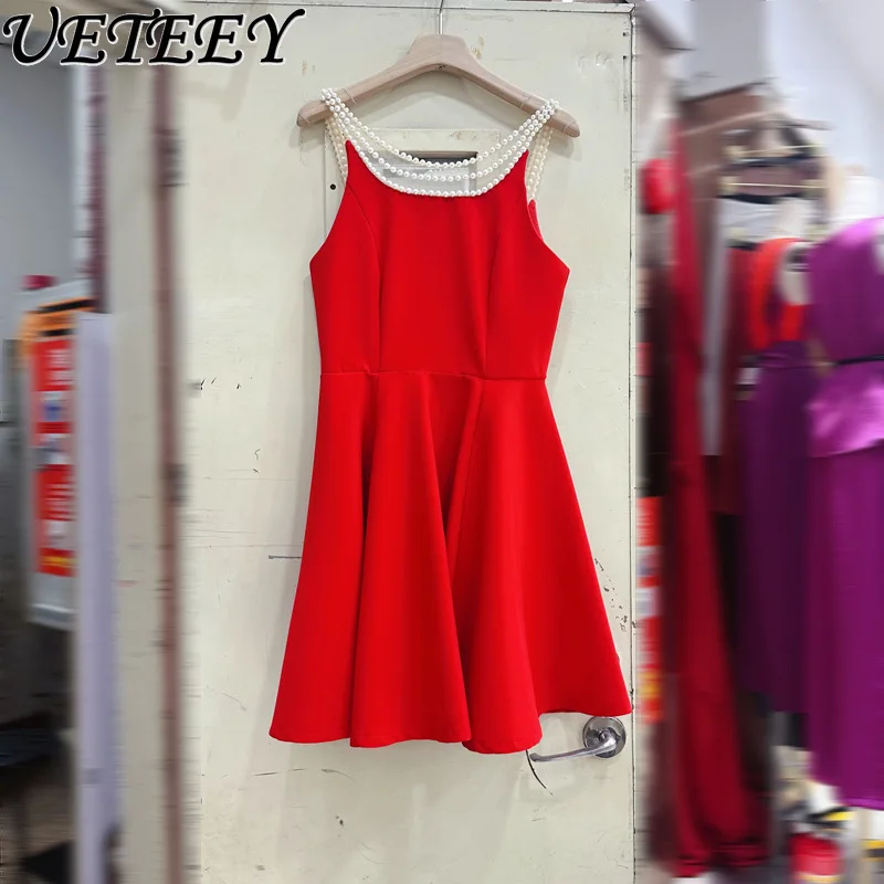 Europejska i amerykańska francuska gwiazda z temperamentem perłowa sukienka na szelkach letnie krótkie sukienki z wysokim stanem i odkrytymi plecami