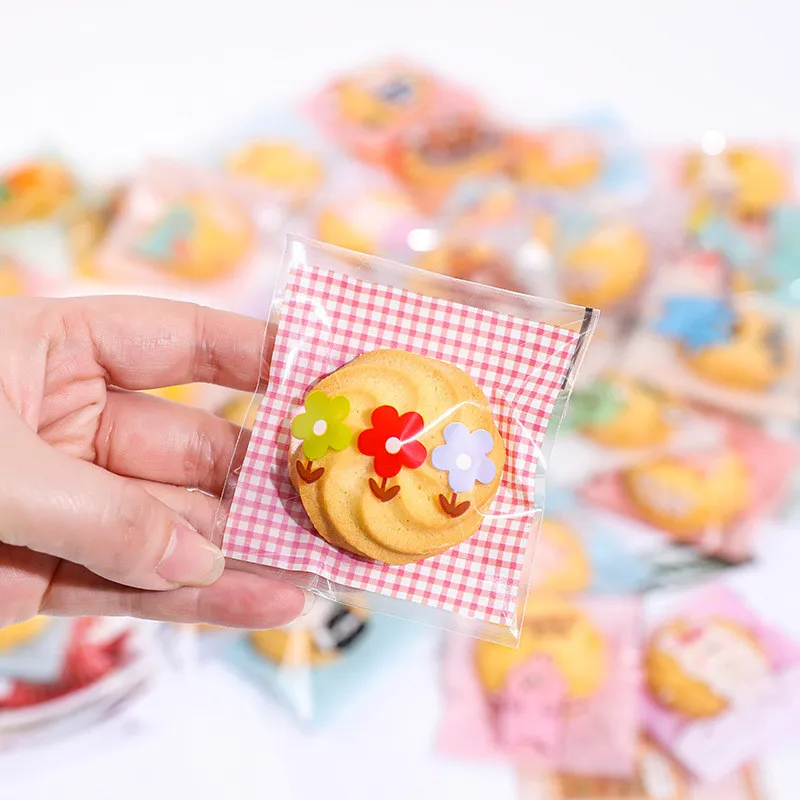 100 Stück 7x7cm/10x10cm Plastik Cartoon Selbstklebende Bäckerei-Verpackungsbeutel für Kekse Snacks Süßigkeiten Geburtstagsparty Geschenk – Detail 3