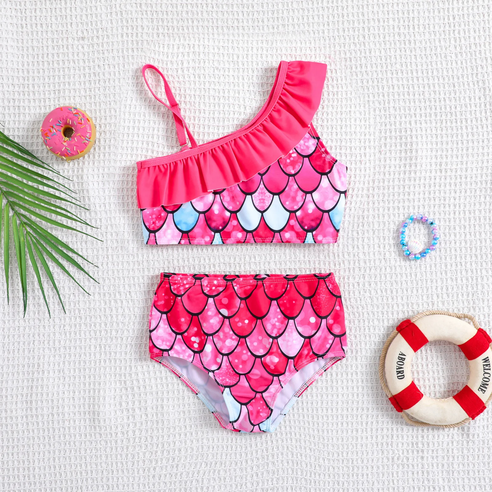 Baby two piece swimsuit printed with colorful fish scale pattern suitable for seaside trips and pool water play