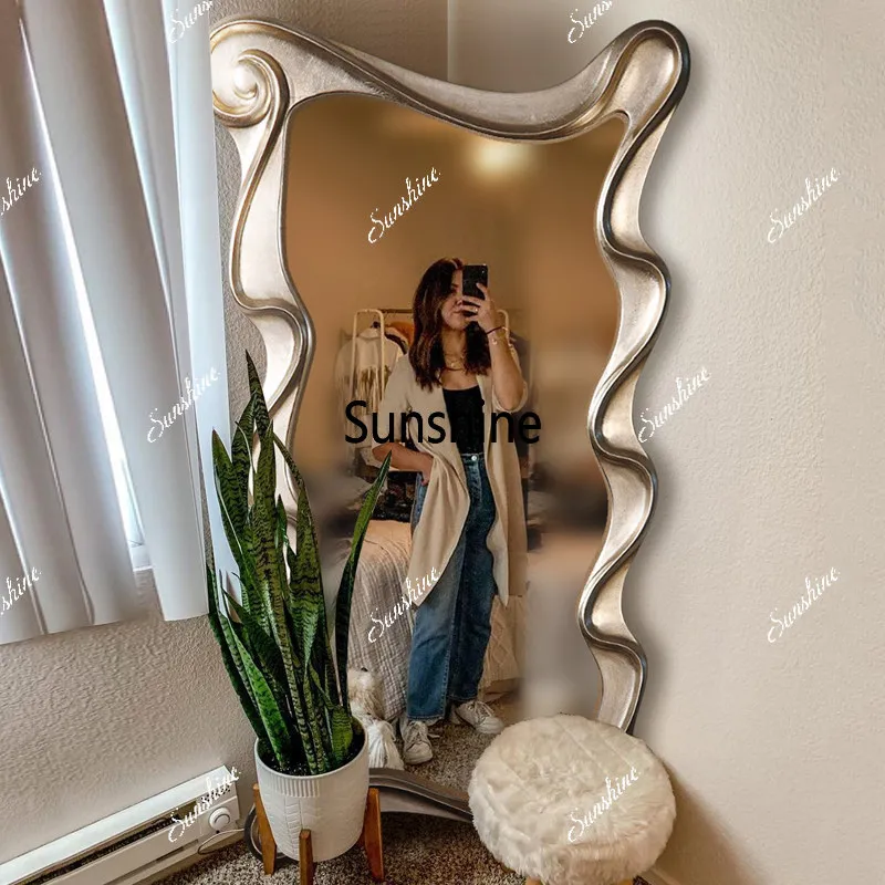 Special-shaped wave floor-to-ceiling full-length mirror against the wall and wall-mounted full-length mirror