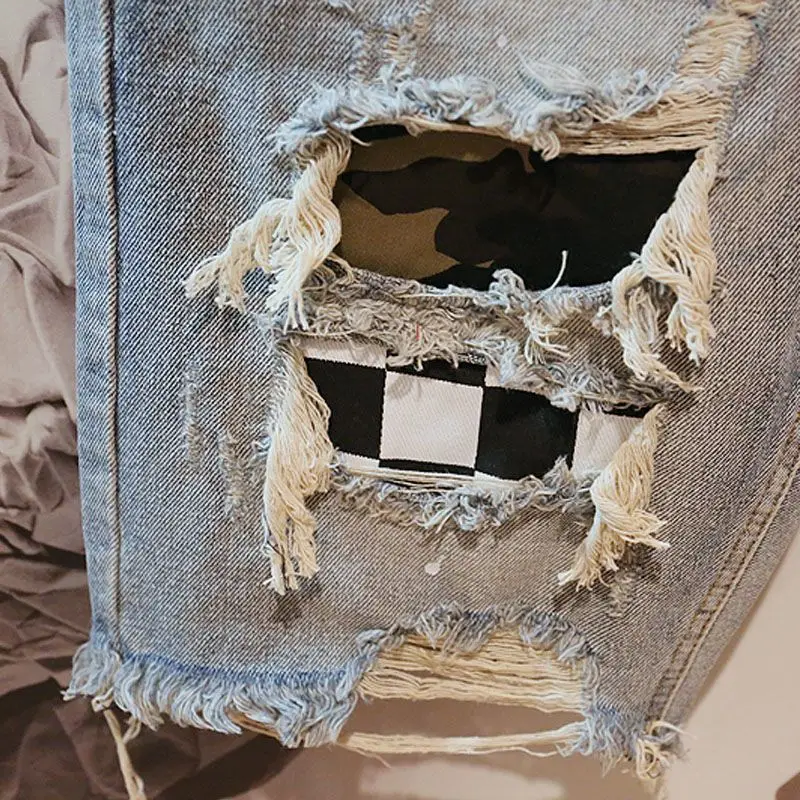 Pantaloncini di Jeans da uomo con ricamo strappato di testo pantaloni di Jeans corti per uomo Designer popolare nuovo nella tendenza originale 2024