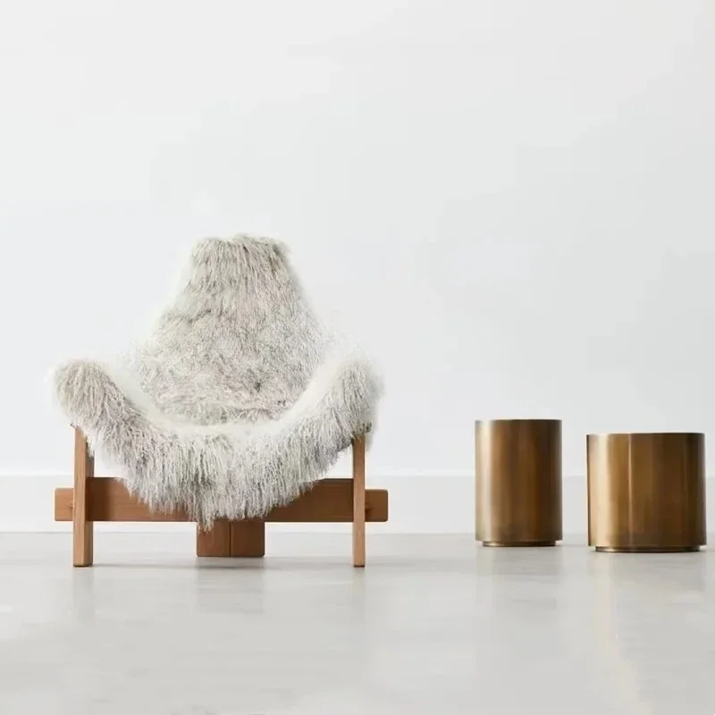 A Italian light luxury minimalist studio club clothing store white long hair lazy chair, casual single chair
