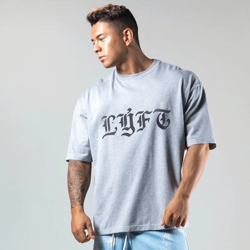 2023 estate Fitness sport lettera stampa semplice t-shirt manica corta da uomo moda Casual cotone sciolto t-shirt Oversize top