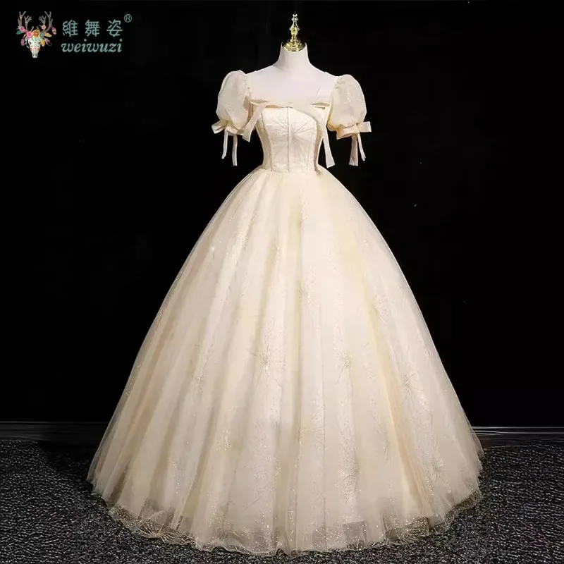 

Champagne colored playful square neck bow Quinceanera Dresses exquisite high waisted hot stamping fabric evening dresses