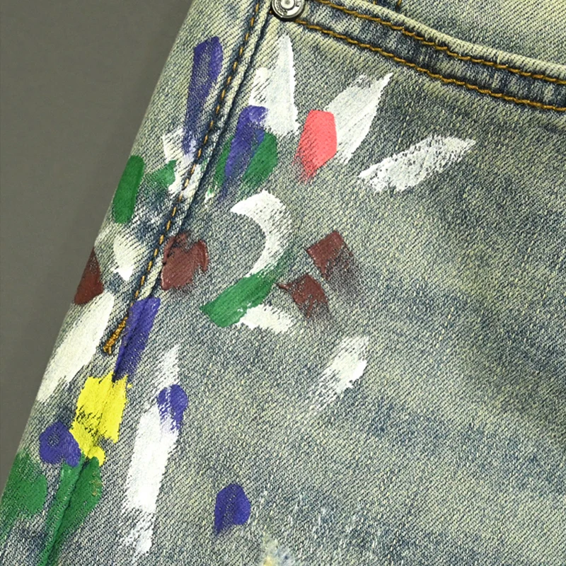 กางเกงยีนส์ผู้ชายสีฟ้าอ่อนรุ่นใหม่ทันสมัย ลายขีดข่วน ล้างน้ำ สไตล์ย้อนยุค ทรงสลิมฟิต ยืดได้ ดีไซน์เนอร์ยีนส์สไตล์เรโทร