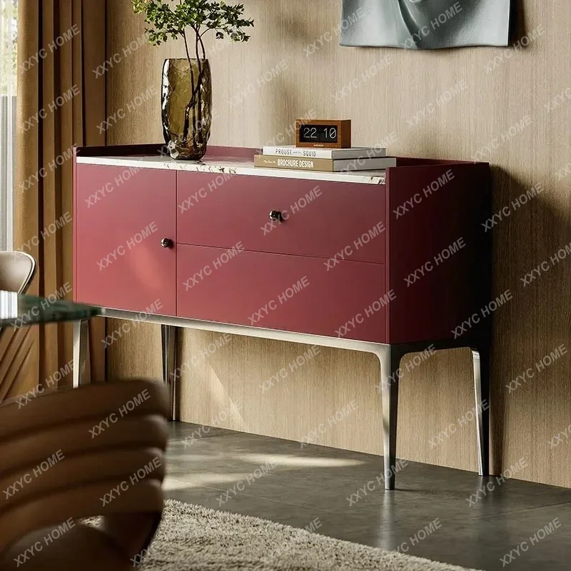 Modern entrance cabinet is facing the door, living room sofa enters  door, and the decorative cabinet is against the wall