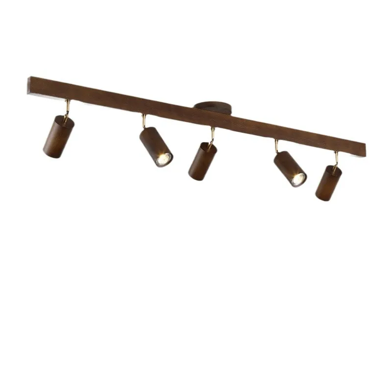 

Living room without main light spotlight, walnut surface mounted background wall track light