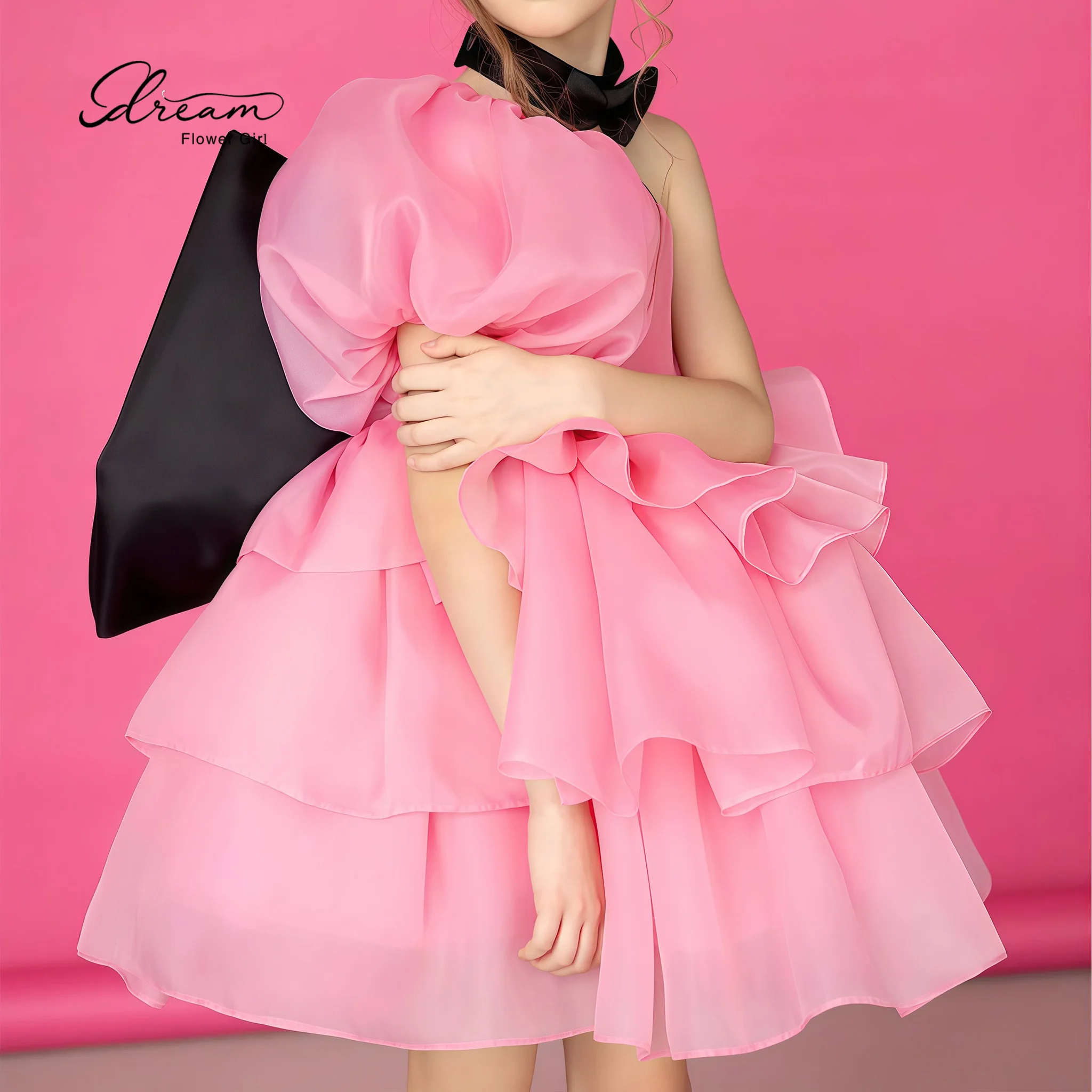 Pink girls' formal party dress featuring a halter-neck strapless-style bodice one-shoulder detail and a voluminous puffed skirt