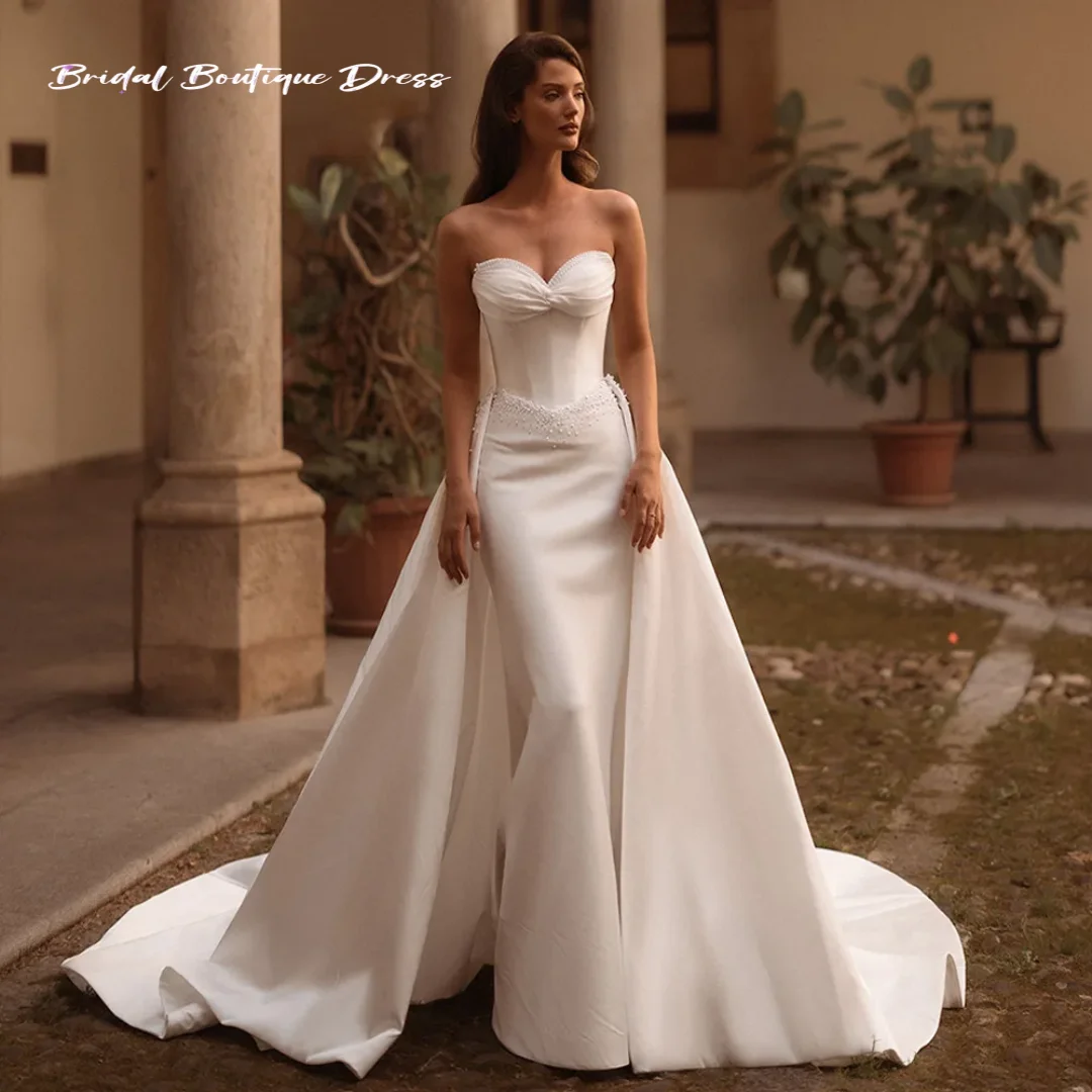 Vestido de novia elegante personalizado con perlas, escote en forma de corazón, sin mangas, cola de barrido, vestido de novia Sexy de sirena con tren desmontable