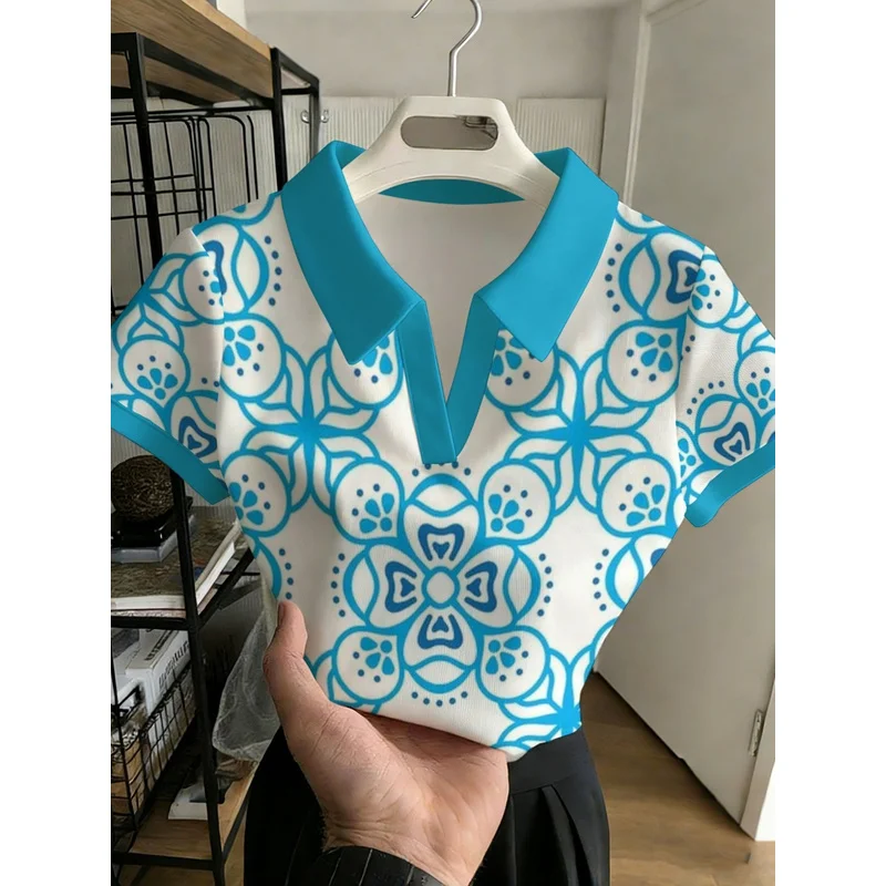 2026New women's fashion versatile buttonless design Polo Shirt Blue and white visual art themed wrapping paper with symmetrical