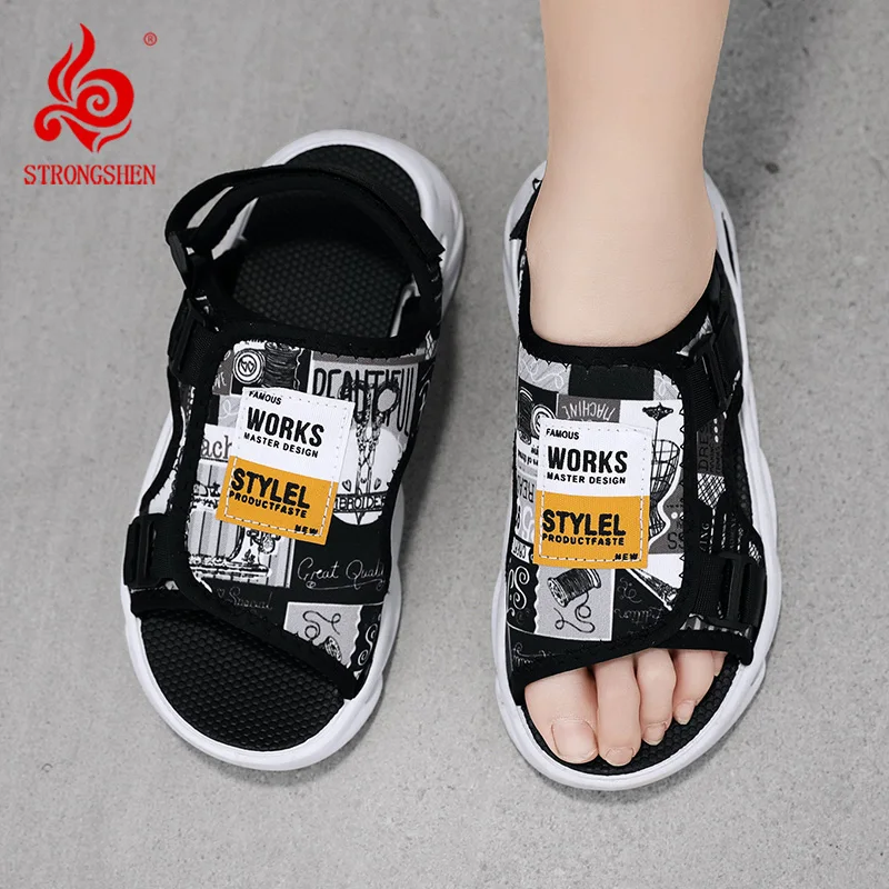 A pair of boys' letter anti slip toe exposed casual trendy sports flat sandals suitable for summer