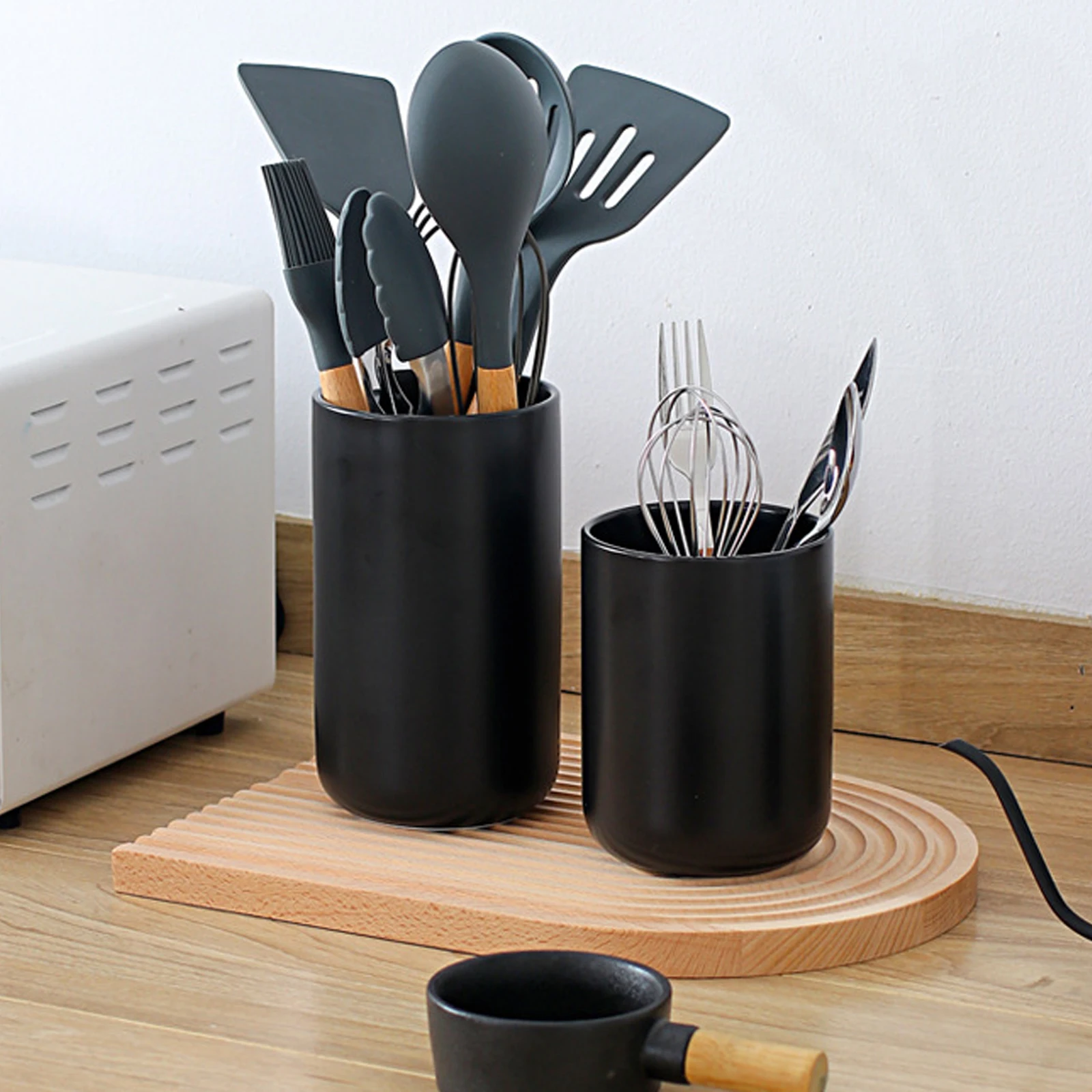 Ceramic Utensil Organizer: Add a touch of classic simplicity to your kitchen with this sturdy, easy-to-clean utensil holder