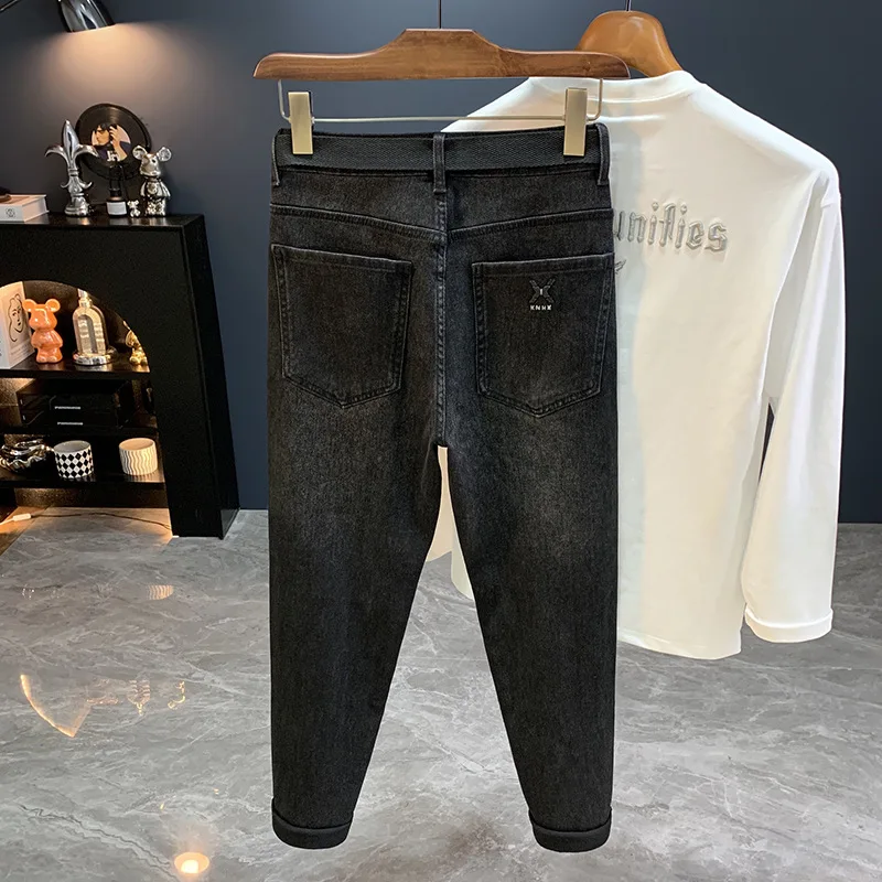 جينز أسود للرجال 2025 خريف جديد ملابس للرجال الراقية العلامة التجارية العصرية القدم الصغيرة عادية مطاطا بنطال ملاصق للجسم