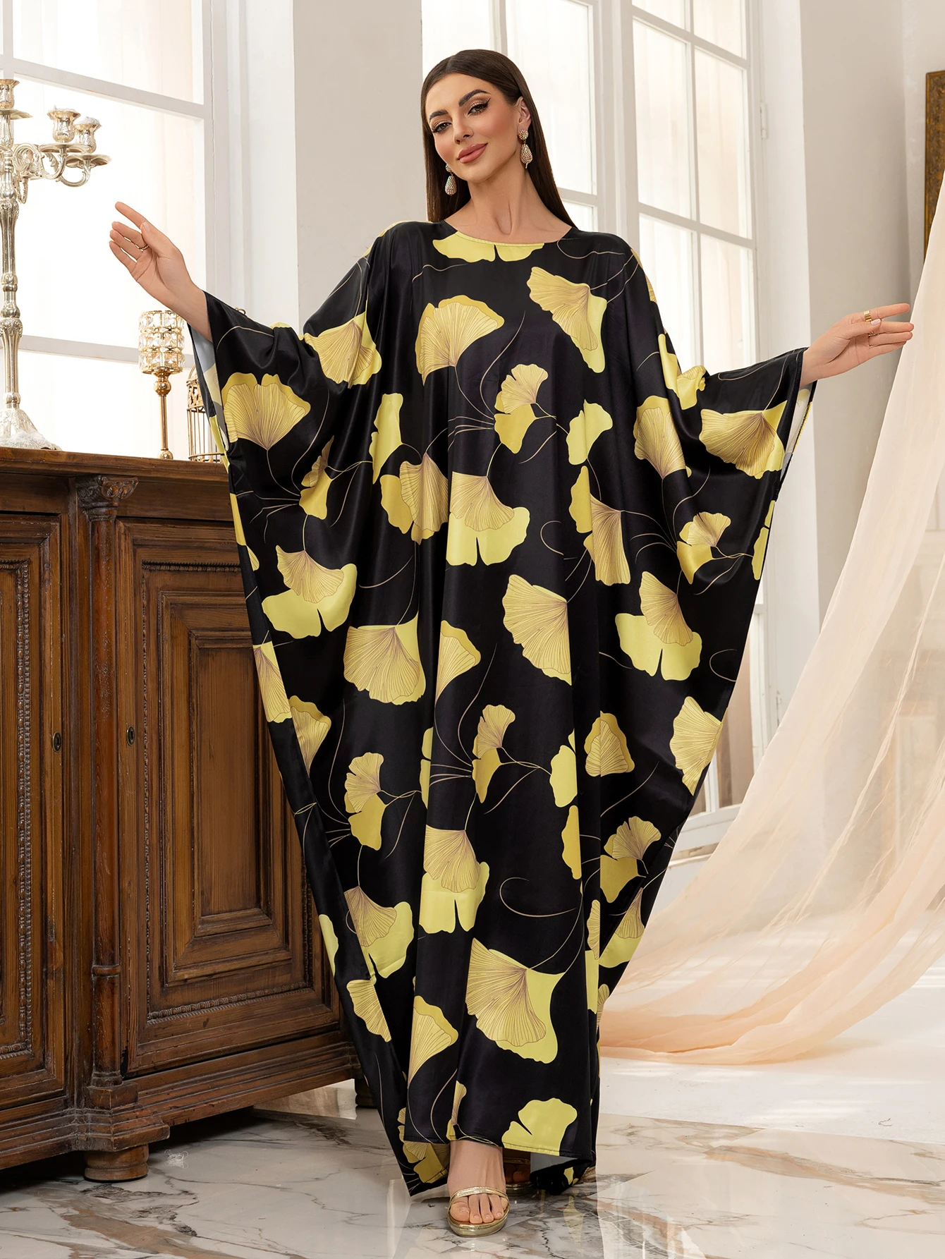 

Dubai Muslim Arabian Dresses Black Islamic Abaya with Yellow Ginkgo Leaf Print Ideal for Stylish Modest Fashion in Middle East