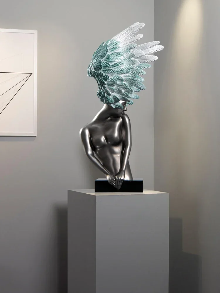 Modern art hotel villa living room decoration. Creative light luxury art angel sculpture decoration.