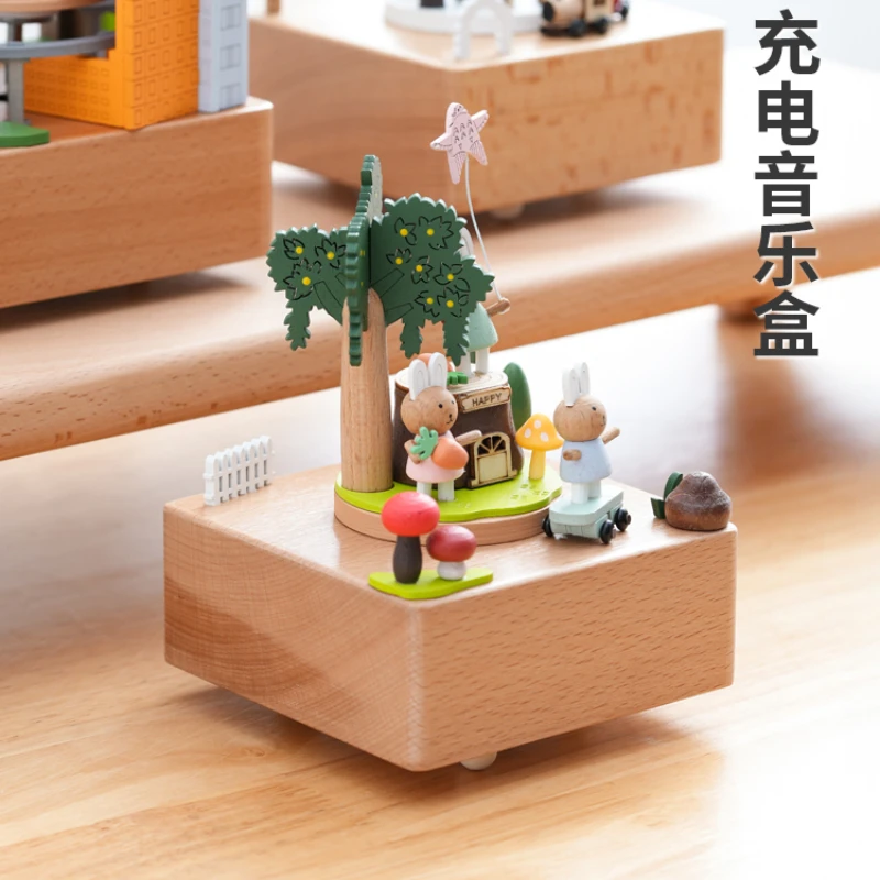 

Cartoon electric music box, rotatable small train, wooden charging, dynamic music box decoration, healing creative gift