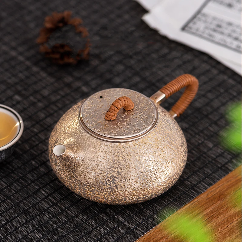 

Pure silver 999 teapot Jingzhou stone ladle household pot pure manual kung fu tea set a silver pot