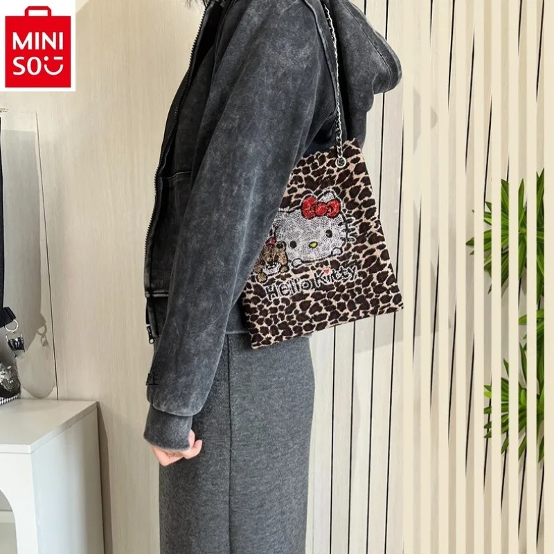 

MINISO 2024 New Cartoon Hello Kitty Flash Diamond Leopard Pattern Crossbody Bag for Women's Versatile Mobile Shoulder Bag