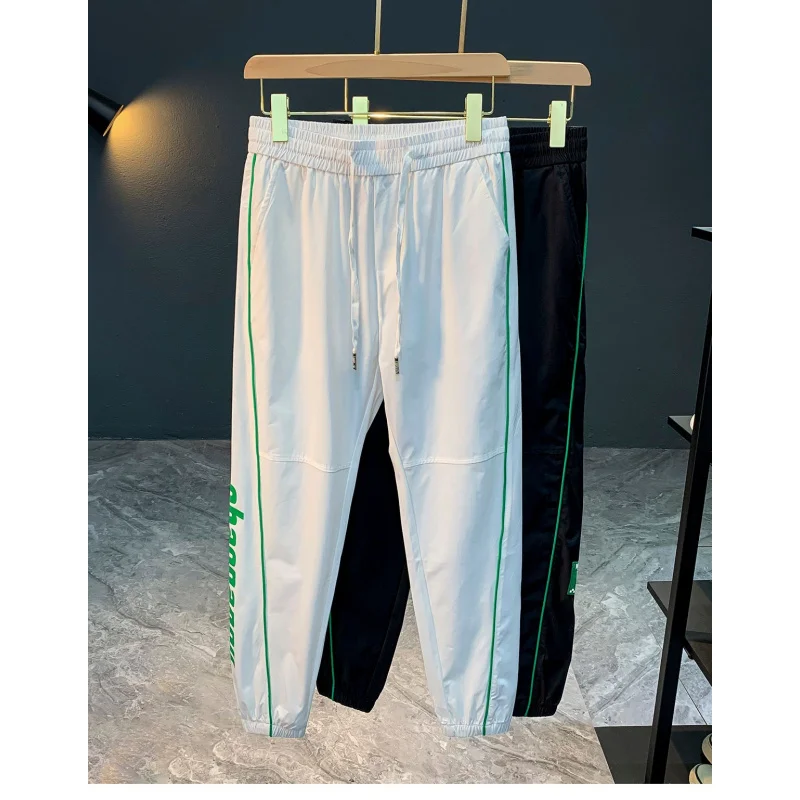 

2025 quick drying casual pants men's ice silk nine point tied foot summer ultra-thin trendy brand printed sports pants