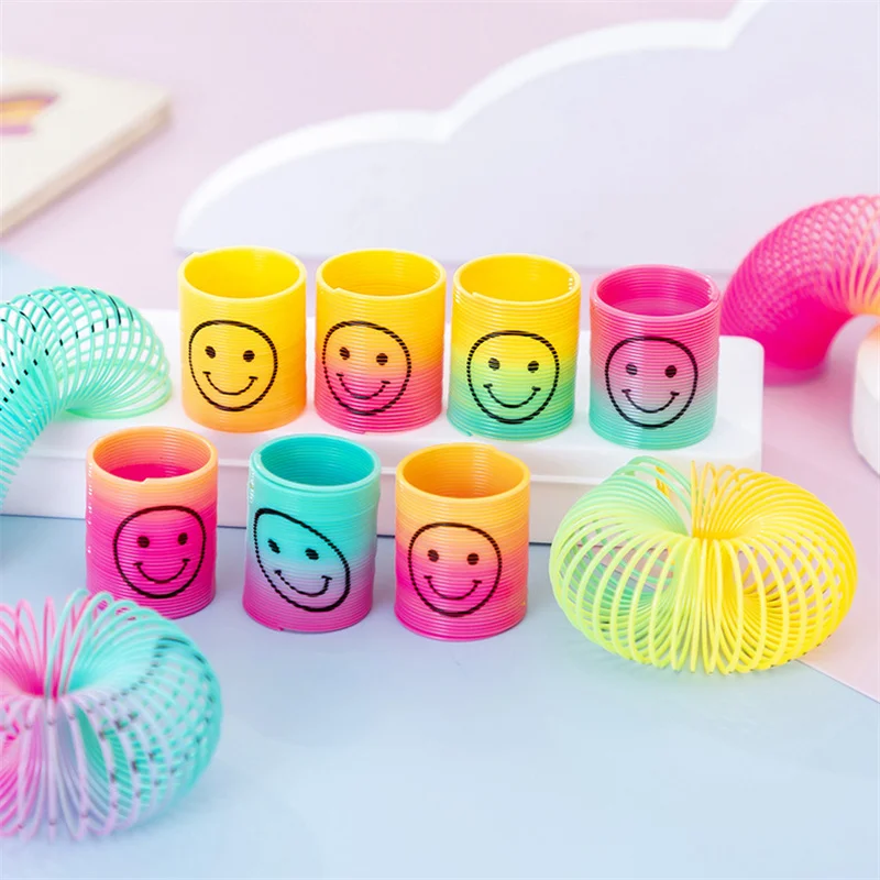 

12Pcs Mini Smiley Face Rainbow Neon Magic Spring Toys Kids Birthday Gifts Baby Shower Guest Party Favors Finger Game Pinata Fill