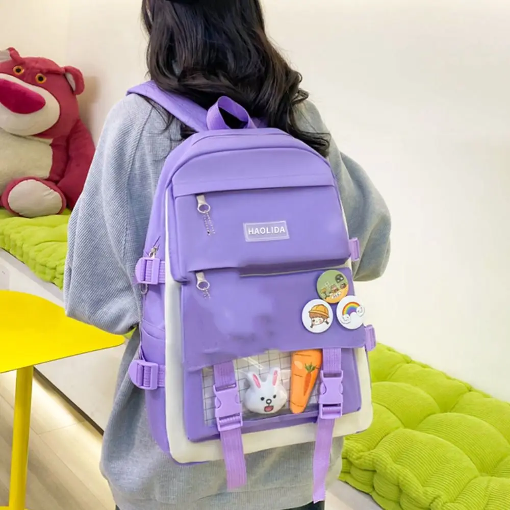 Mochila de gran capacidad de nailon para niños, bolso de lona con insignia de viaje, mochila de hombro, un conjunto de cuatro mochilas escolares simples de estilo coreano