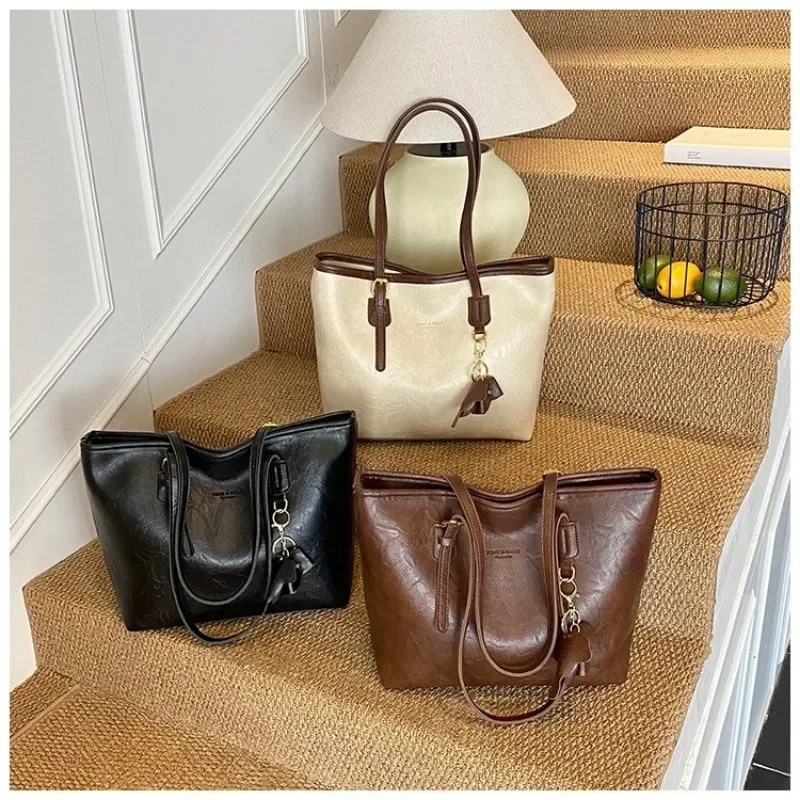 

Стильная винтажная кожаная сумка-сэтчел для женщин, дизайнерская сумка через плечо класса люкс, вместительная сумка для подгузников, элегантная городская минималистичная сумка-тоут