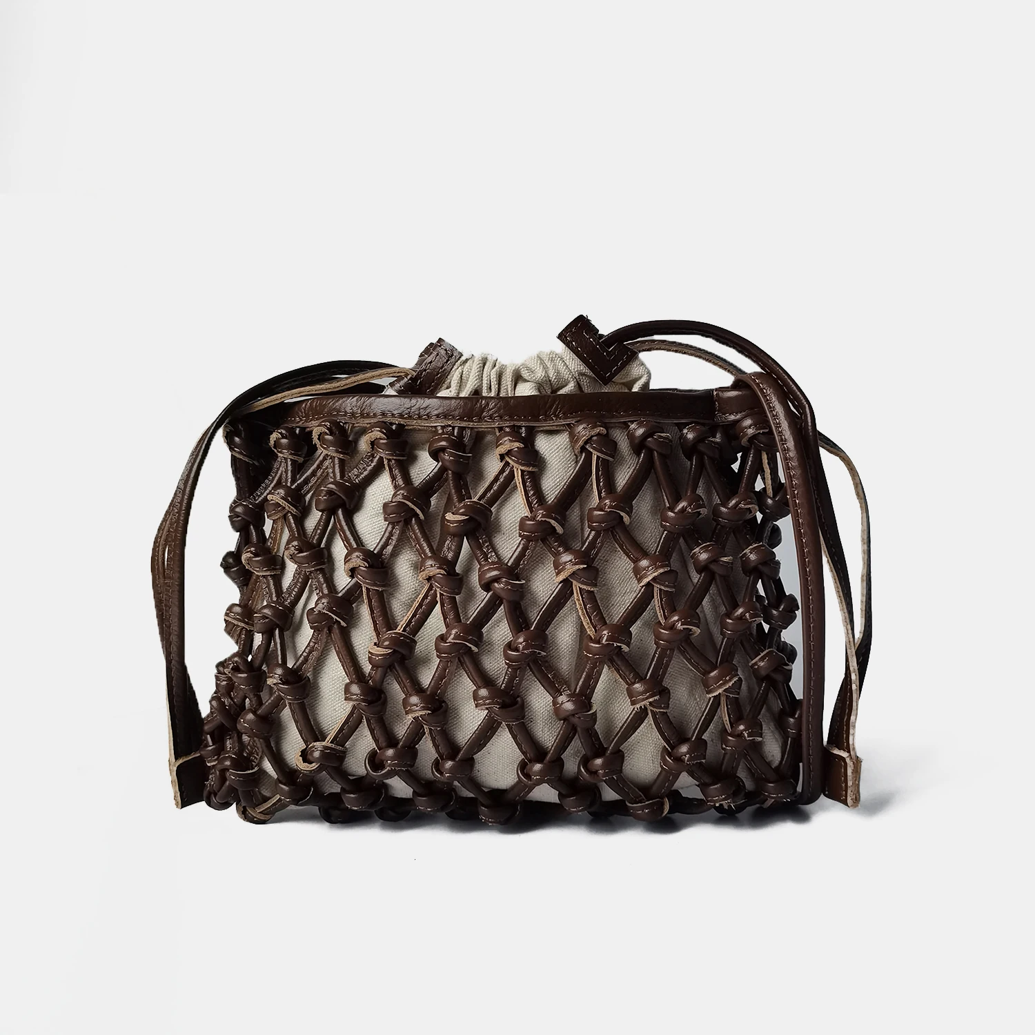 

Niche ladies' handbags fashionable woven hollow small bag high-end casual women's bag net bag crossbody bag cowhide leather