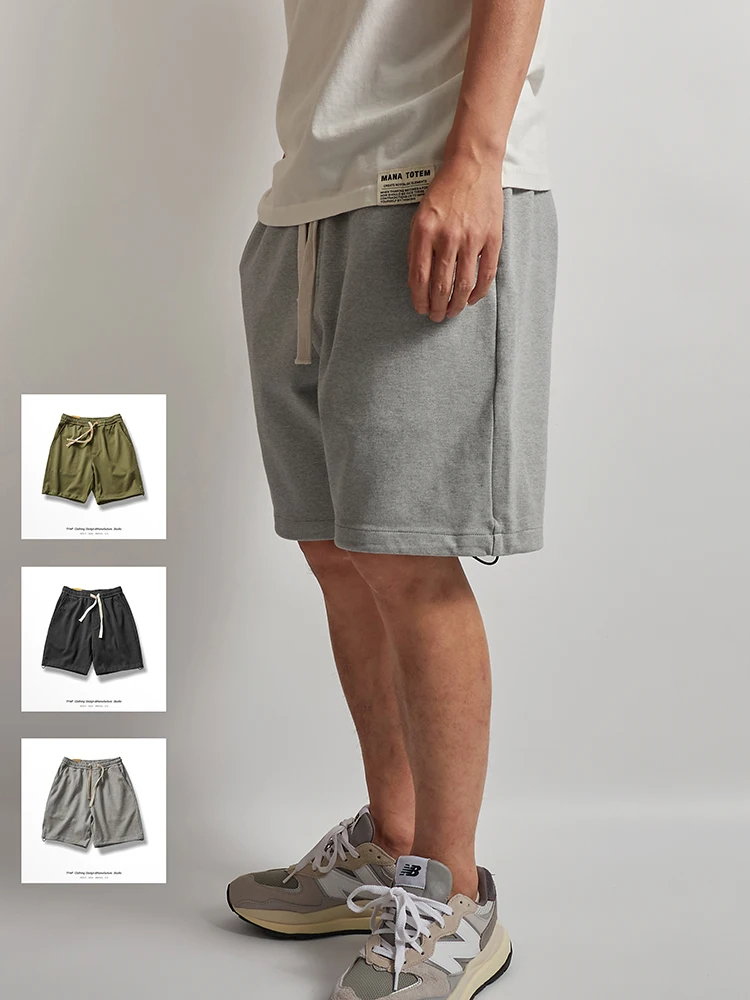 

Высококачественный коврик, тяжелые спортивные мужские повседневные свободные вязаные спортивные штаны, летние молодежные активные брюки с пятью четверками...