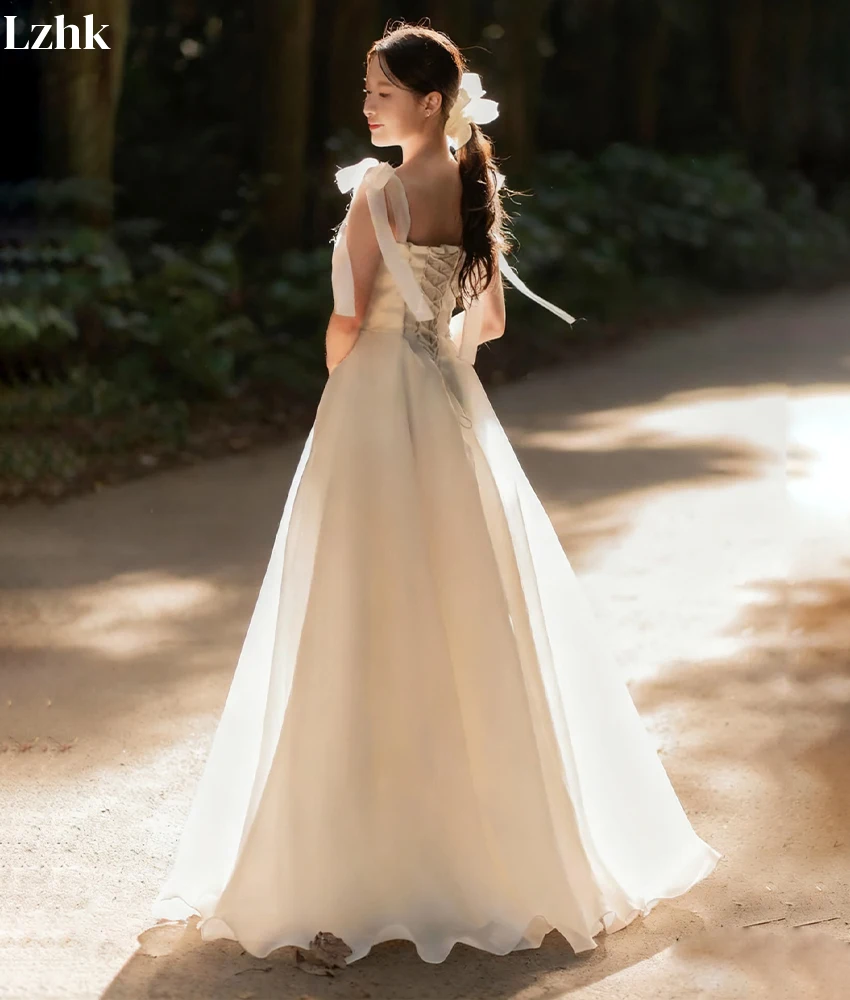 ชุดราตรีทรงเอไลน์ผ้าทูลล์คุณภาพสูงแบบสั่งทำพิเศษ สายเดี่ยวแบบสปาเก็ตตี้ ประดับโบว์ 3 มิติ ดีไซน์ทันสมัย ไม่มีสายคล้องไหล่ สำหรับงานแต่งงาน