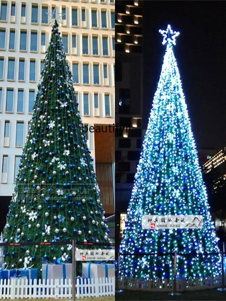 

Large Christmas tree, outdoor venue blue silver ornaments glowing tree C56