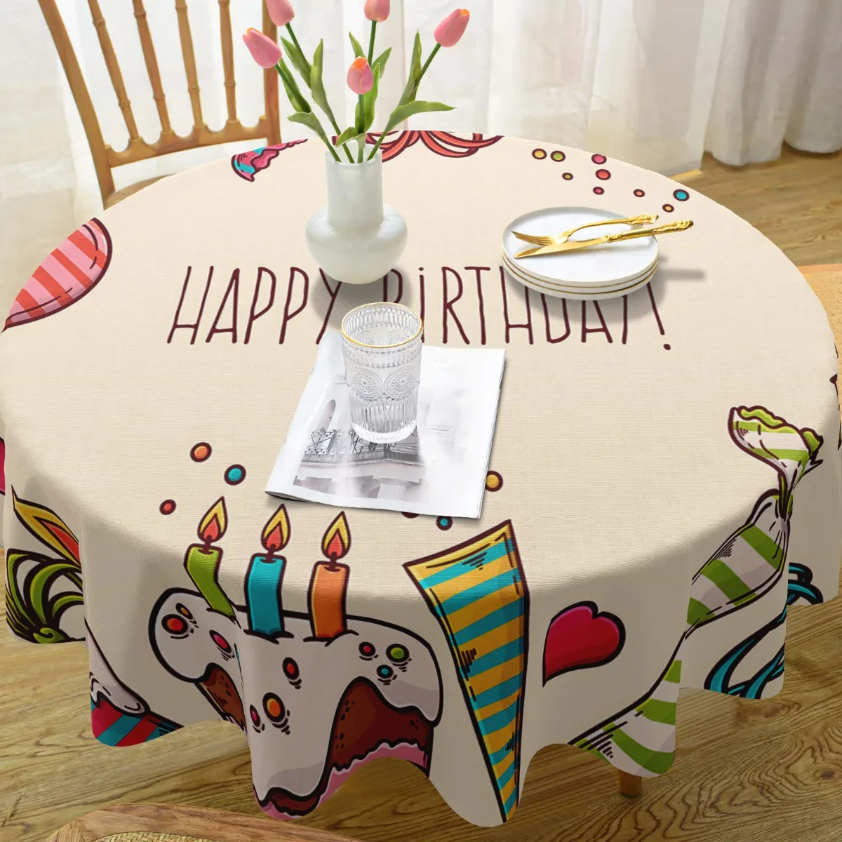 A round rectangular polyester tablecloth printed with birthday party-themed patterns