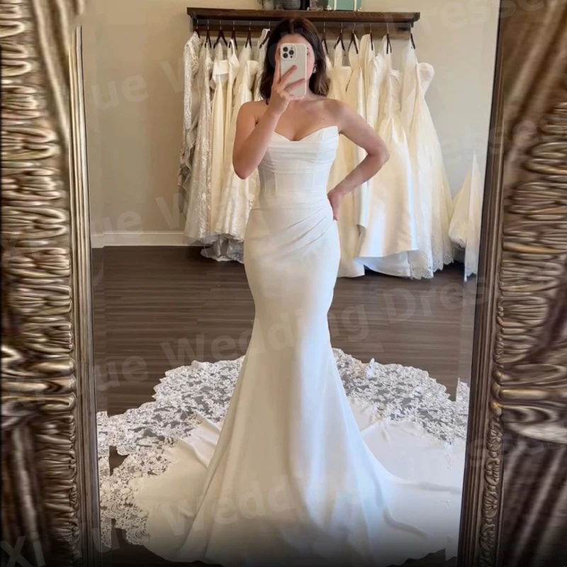 Eleganckie suknie ślubne w stylu syreny z koronkowymi aplikacjami, suknie ślubne bez pleców, suknie dla panny młodej szyte na miarę, dekolt w serek, suknia ślubna.