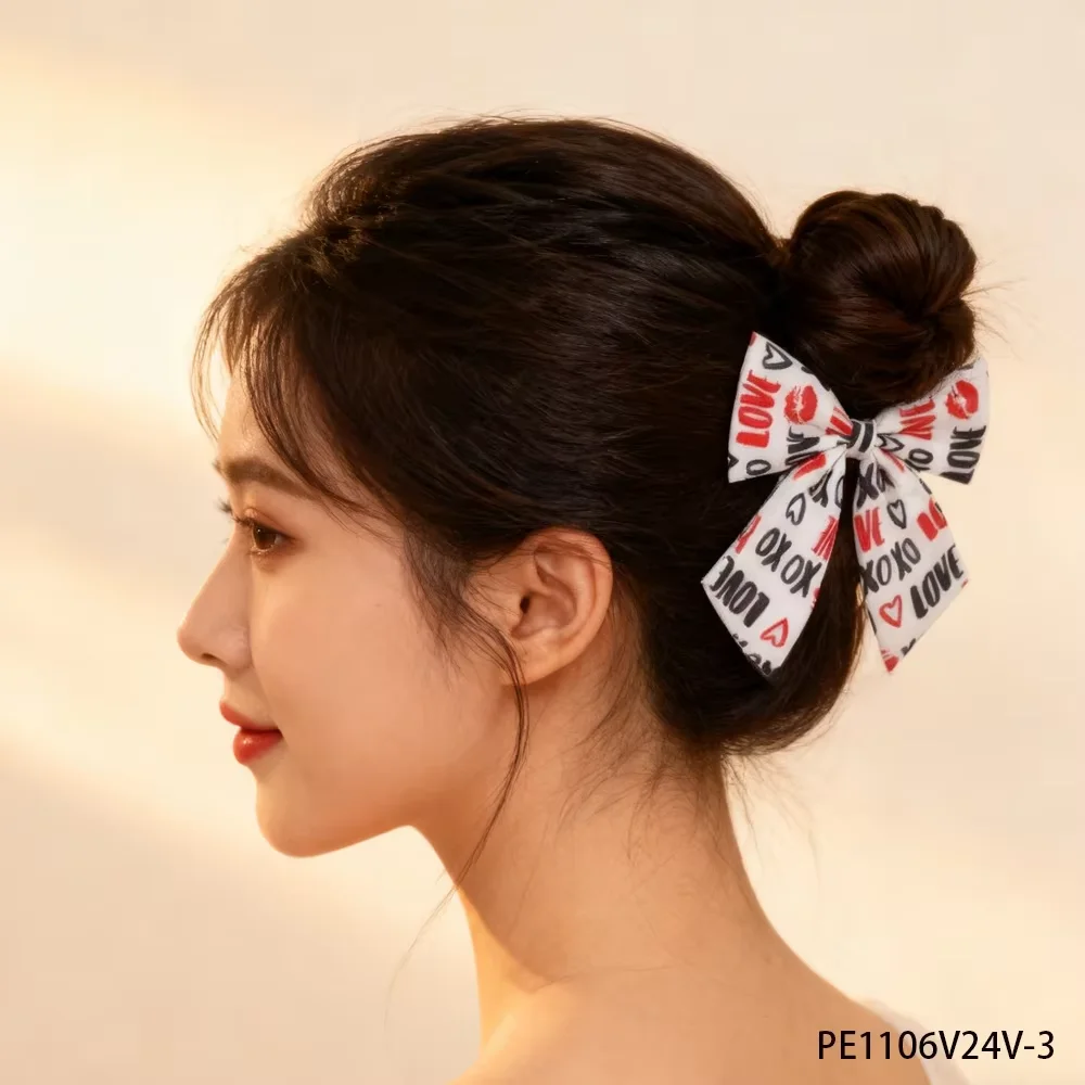 PESENAR With a pink heart lipstick and monogram on a white background this hair accessory is perfect for Valentine's Day