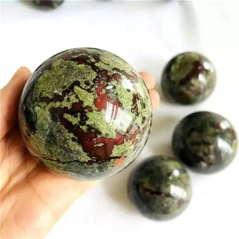 Natural Dragon's Blood Stone crystal sphere, capable of healing with its energy, suitable for home and office decoration, and fo
