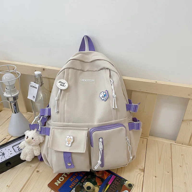 New Cute Girl Backpack Campus Large Capacity Schoolbag Junior High School Students Cute Backpack with Medal Pendant