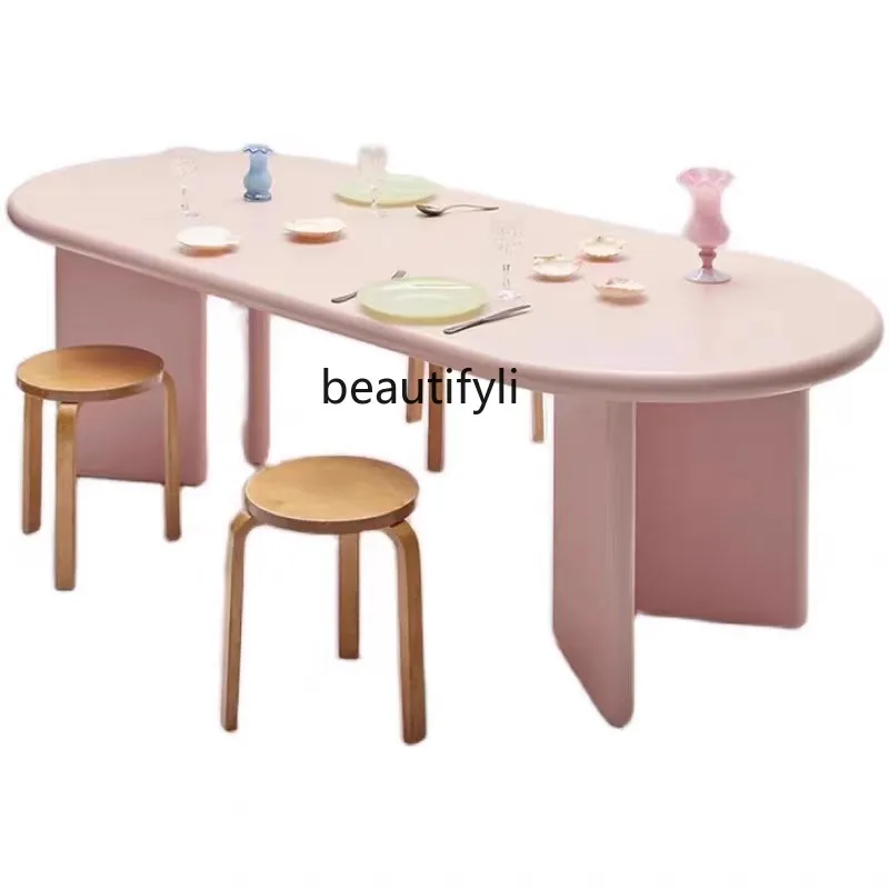 

Nordic solid wood cream style dining table modern simple oval household long table creative negotiation table workbench