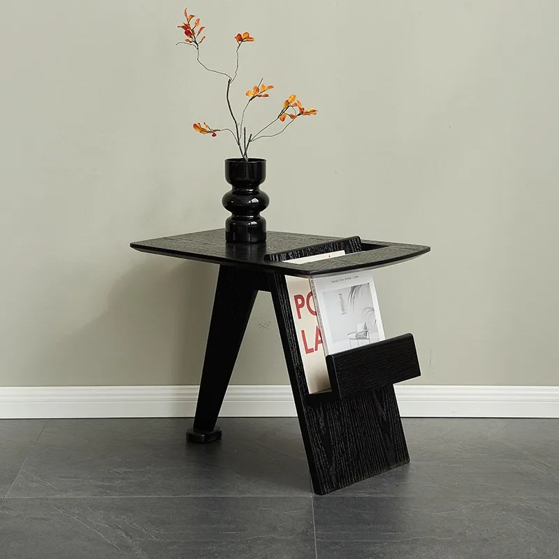 

Couch side, living room creative corner, Italian minimalist black small coffee table, household book and newspaper shelf edge