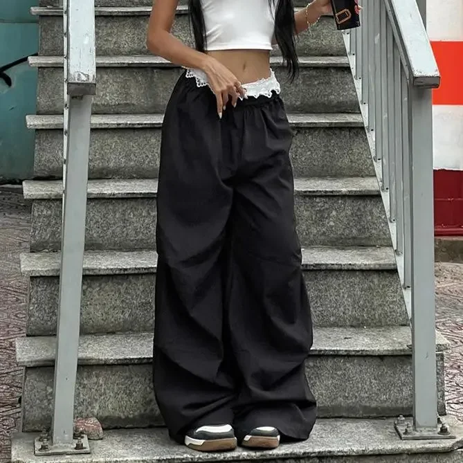 Pantaloni casual con ricamo in pizzo da strada Pantaloni a gamba larga da ragazza piccanti a vita bassa da donna