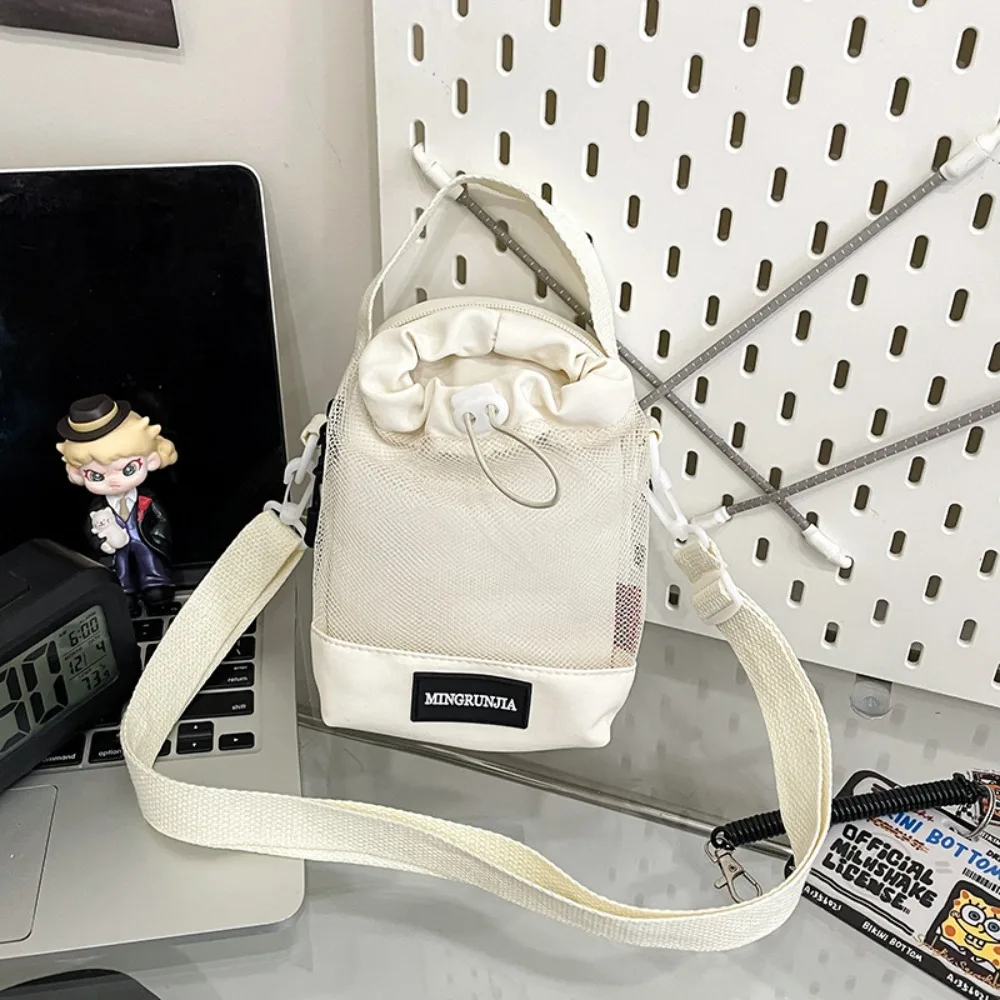 กระเป๋าใส่ขวดน้ำแบบสะพายไหล่ ตาข่าย ไนลอน มีช่องด้านหน้า สายสะพายข้าง พร้อมหูหิ้ว พกพาสะดวก