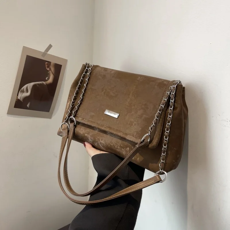

High-Fashion Designer Handbag For Women With Iconic Buckle Detail And Leather Construction For A Statement Look