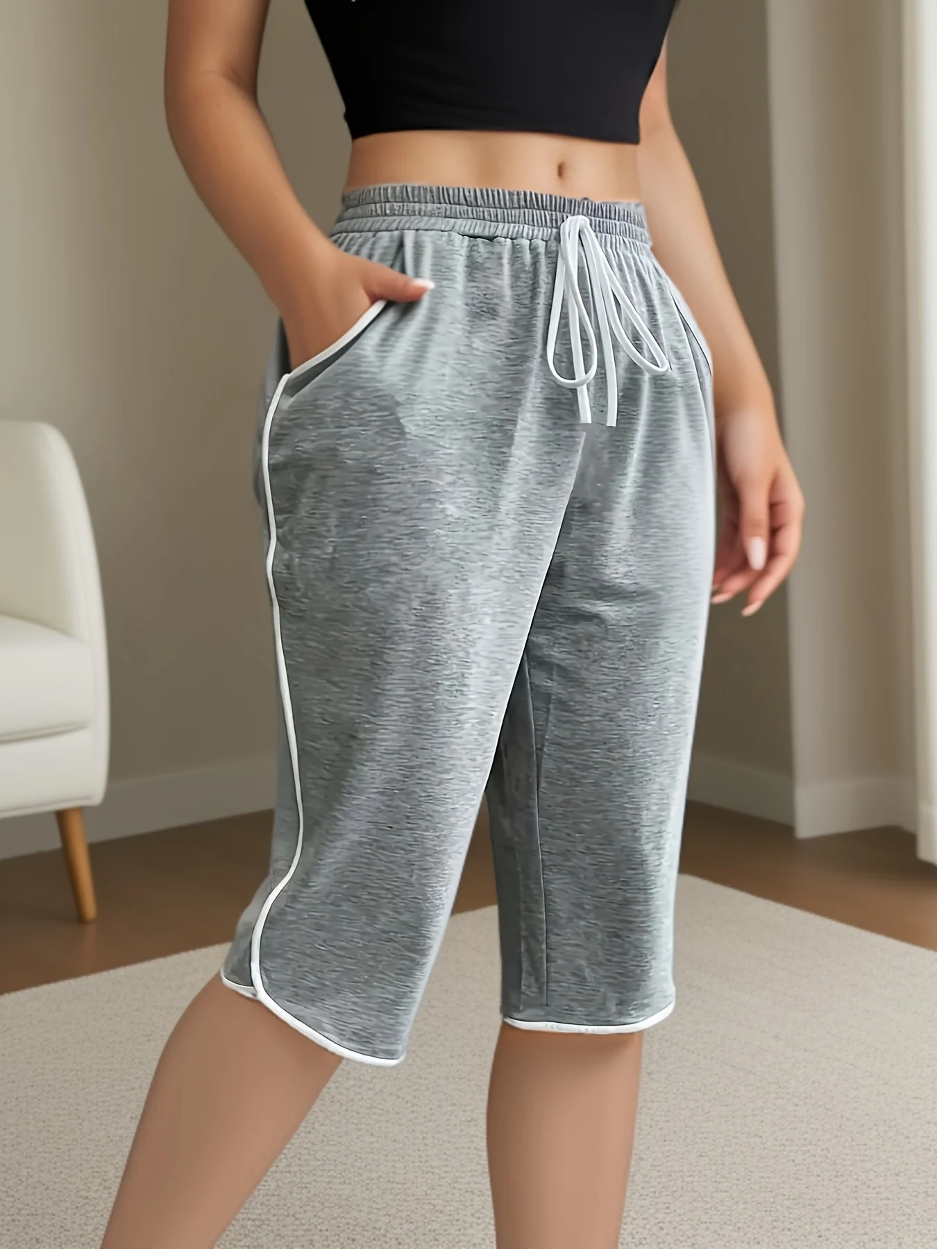 حجم كبير 1XL-5XL المرأة أزياء مريحة بسط ثلاثة أرباع السراويل للنساء عارضة بلون جيوب وظيفية السراويل