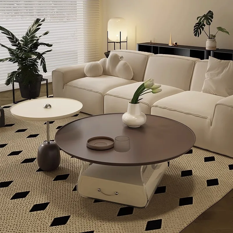 Cream-style round coffee table, small living room, simple modern home, small red book, the same French acrylic coffee table