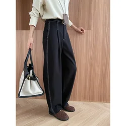 Deconstructed, split exposed outer seams, straight, loose, drapey casual pants with a yuppie vibe.