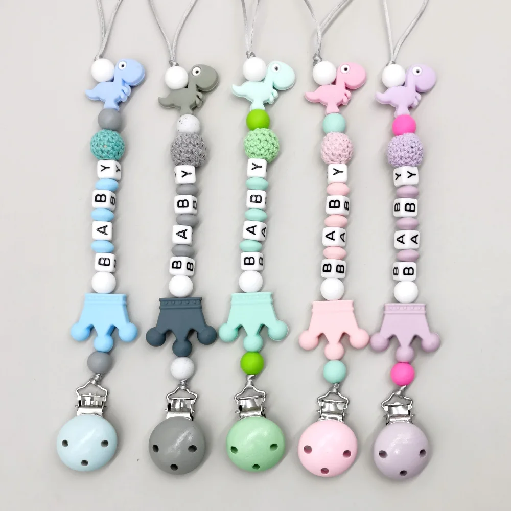 

Custom Handmade Personalized Name Silicone Letters Beads Pacifier Clips Chain Baby Teether Holder Dinosaur Chew Nursing Gift