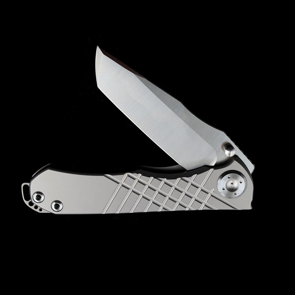 Cuchillo plegable con mango de titanio Chris Reeve Umnumzaan 100% N690