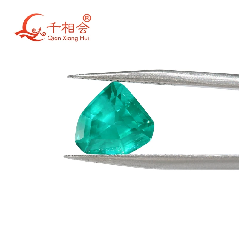 

Shield Shape Lab Grown Paraiba Color Yttrium Aluminum Garnet Gem Stone Irregular Tsavorite with Inclusions Cultivated